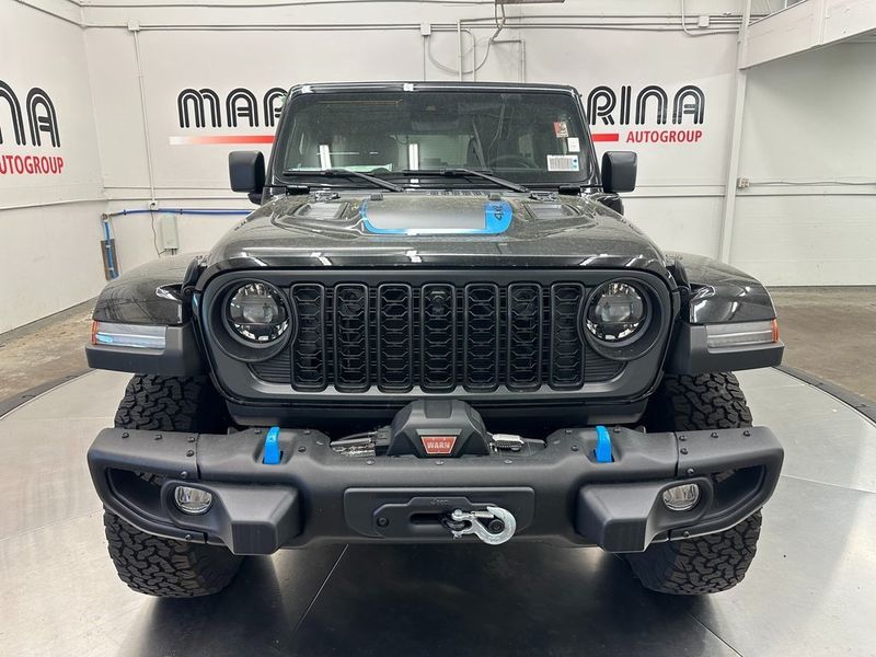 2024 Jeep Wrangler 4-door Rubicon X 4xe in a Black Clear Coat exterior color and Blackinterior. Marina Chrysler Dodge Jeep RAM (855) 616-8084 marinadodgeny.com 