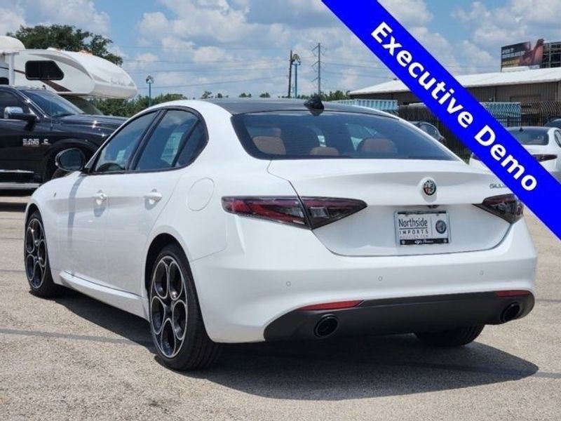 2024 Alfa Romeo Giulia Ti in a Alfa White exterior color and Saddle Browninterior. Northside Imports Houston 281-475-4549 northsideimportshouston.com 