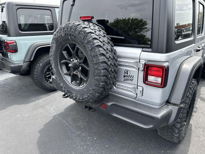 2024 Jeep Wrangler 4-door Willys in a Silver Zynith Clear Coat exterior color and Blackinterior. Gupton Motors Inc 615-384-2886 guptonmotors.com 