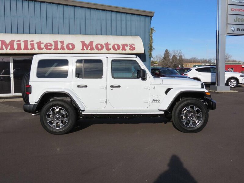 2024 Jeep Wrangler 4-door Sahara in a Bright White Clear Coat exterior color and Blackinterior. Militello Motors ​507-200-4344 militellomotors.net 