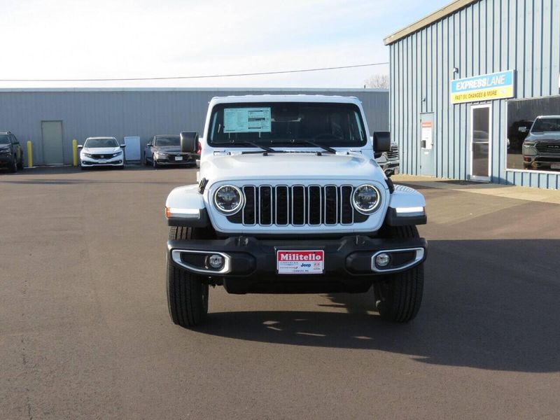 2024 Jeep Wrangler 4-door Sahara in a Bright White Clear Coat exterior color and Blackinterior. Militello Motors ​507-200-4344 militellomotors.net 