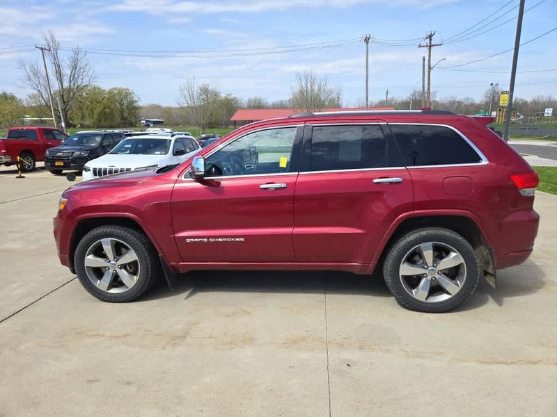 2014 Jeep Grand Cherokee Overland in a Deep Cherry Red Crystal Pearl Coat exterior color and Blackinterior. Dave Warren Chrysler Dodge Jeep Ram (716) 708-1207 davewarrenchryslerdodgejeepram.com 