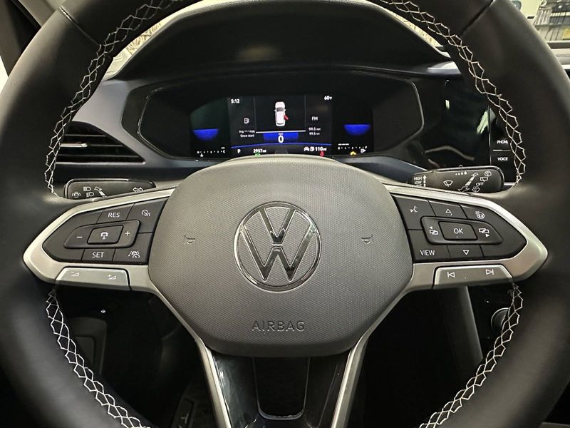 2023 Volkswagen Taos SE w/Sunroof & Black Wheel Pkg in a Pyrite Silver Metallic exterior color and Black Heated Seatsinterior. Schmelz Countryside Alfa Romeo and Fiat (651) 968-0556 schmelzfiat.com 