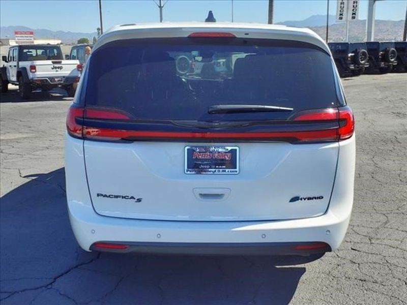 2023 Chrysler Pacifica Hybrid Touring L in a Bright White Clear Coat exterior color and Blackinterior. Perris Valley Chrysler Dodge Jeep Ram 951-355-1970 perrisvalleydodgejeepchrysler.com 