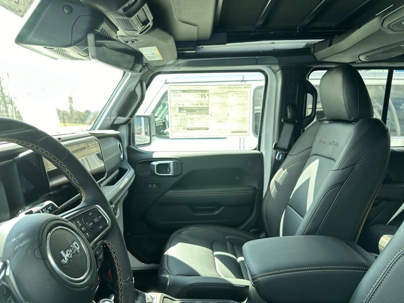 2024 Jeep Wrangler 4-door Sahara in a Bright White Clear Coat exterior color. Gupton Motors Inc 615-384-2886 guptonmotors.com 