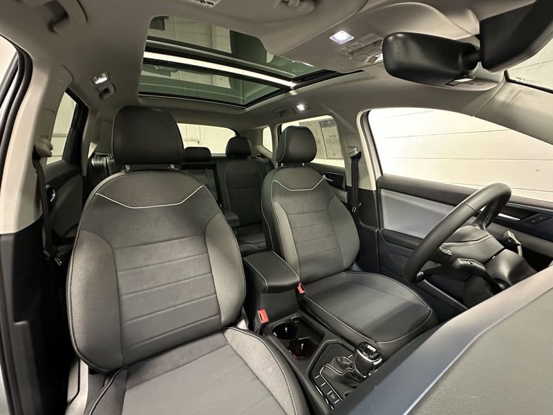 2023 Volkswagen Taos SE w/Sunroof & Black Wheel Pkg in a Pyrite Silver Metallic exterior color and Black Heated Seatsinterior. Schmelz Countryside Alfa Romeo (651) 867-3222 schmelzalfaromeo.com 