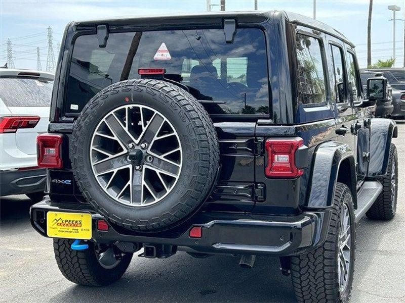 2024 Jeep Wrangler 4-door High Altitude 4xe in a Black Clear Coat exterior color and Blackinterior. McPeek