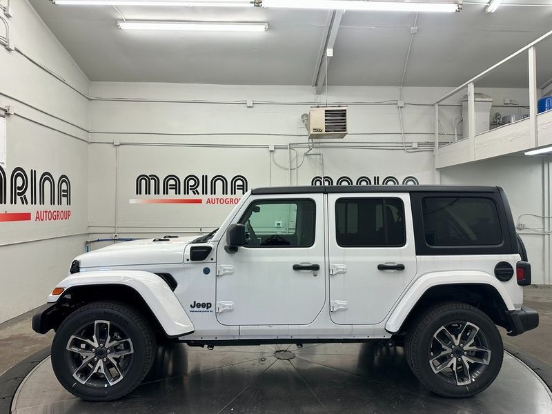 2024 Jeep Wrangler 4-door Sport S 4xe in a Bright White Clear Coat exterior color and Blackinterior. Marina Chrysler Dodge Jeep RAM (855) 616-8084 marinadodgeny.com 