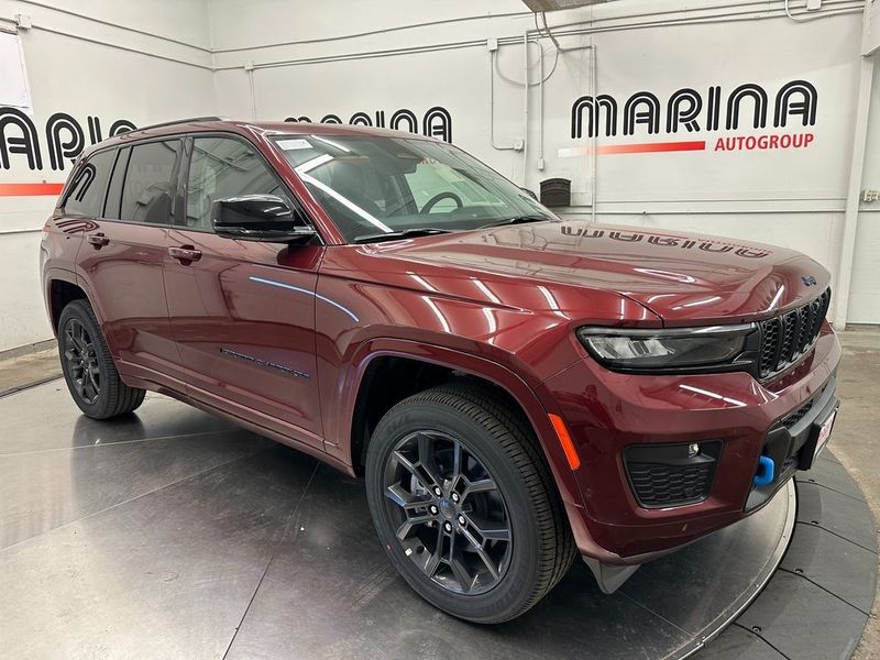 2024 Jeep Grand Cherokee Anniversary Edition 4xe in a Velvet Red Pearl Coat exterior color and Global Blackinterior. Marina Auto Group (855) 564-8688 marinaautogroup.com 