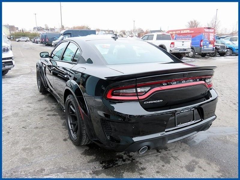 2023 Dodge Charger SRT Hellcat Widebody in a Pitch Black exterior color and Blackinterior. Papas Jeep Ram In New Britain, CT 860-356-0523 papasjeepram.com 