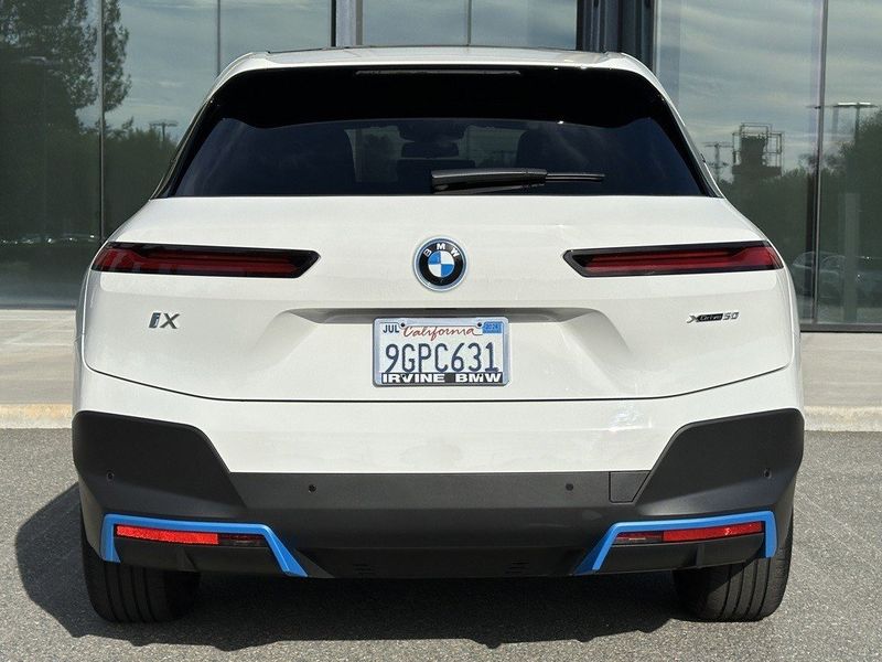 2023 BMW iX xDrive50 in a Alpine White exterior color and Blackinterior. SHELLY AUTOMOTIVE shellyautomotive.com 