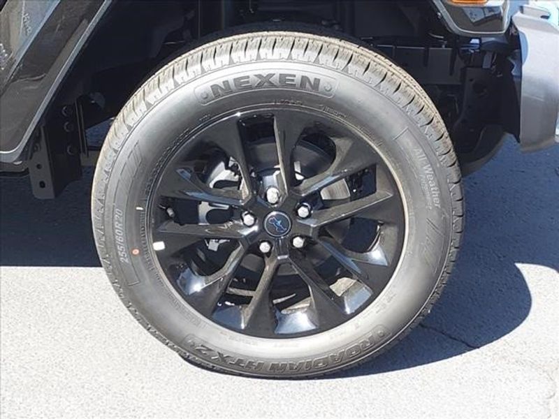 2024 Jeep Wrangler Sahara 4xe in a Black Clear Coat exterior color and Blackinterior. Perris Valley Auto Center 951-657-6100 perrisvalleyautocenter.com 