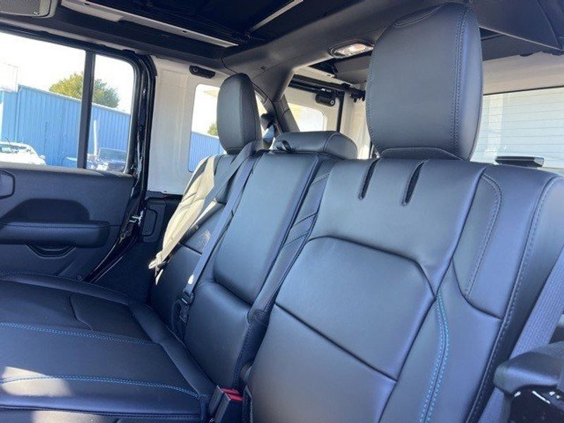 2024 Jeep Wrangler 4-door Rubicon X 4xe in a Black Clear Coat exterior color and Blackinterior. Lakeshore CDJR Seaford 302-213-6058 lakeshorecdjr.com 