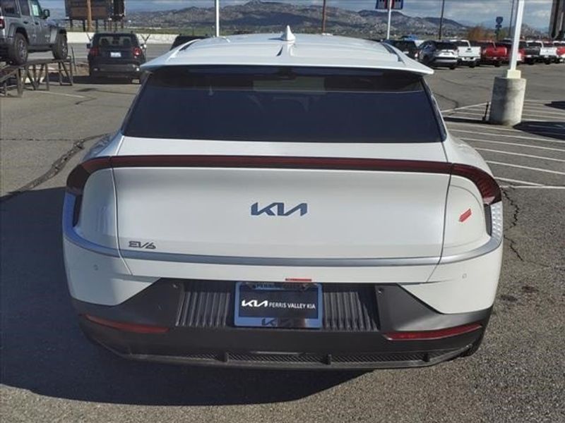 2024 Kia EV6 Light in a Snow White Pearl exterior color and Blackinterior. Perris Valley Auto Center 951-657-6100 perrisvalleyautocenter.com 
