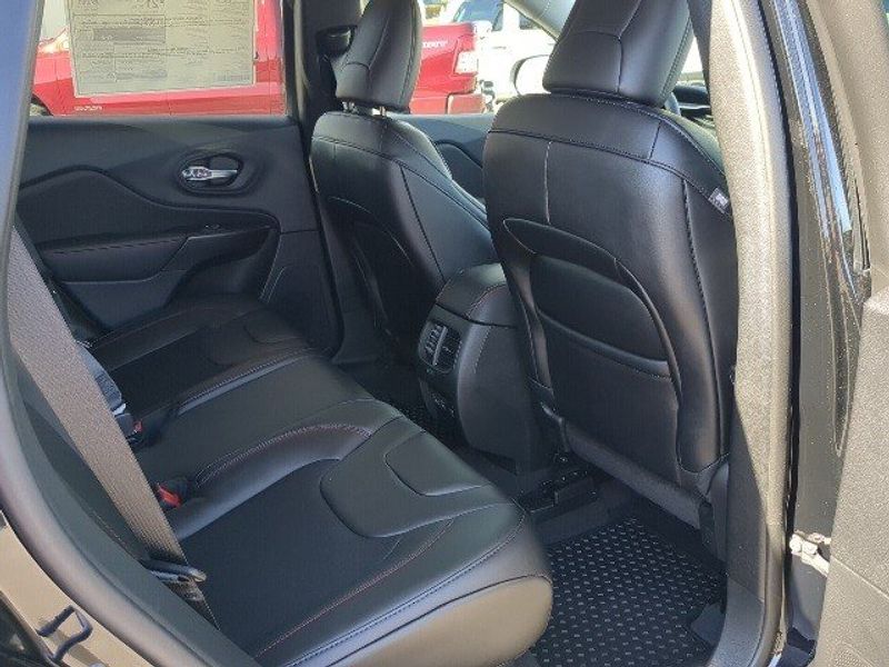 2022 Jeep Cherokee Trailhawk in a Diamond Black Crystal Pearl Coat exterior color and Blackinterior. Matthews Chrysler Dodge Jeep Ram 918-276-8729 cyclespecialties.com 