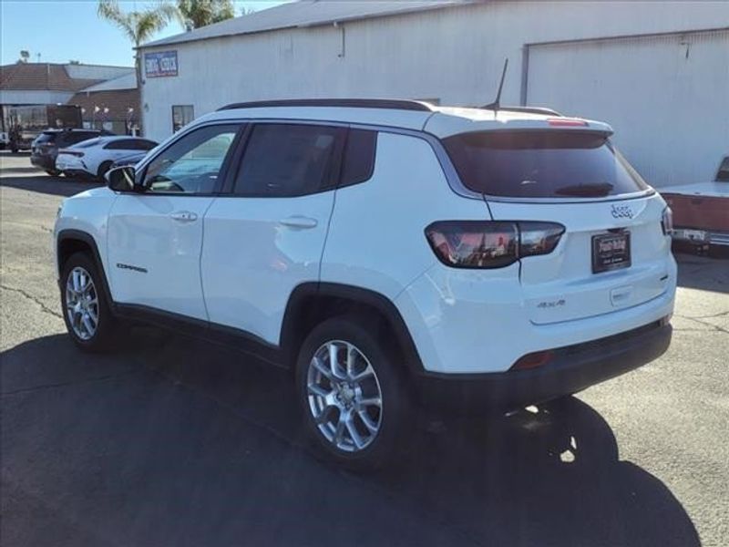 2024 Jeep Compass Latitude Lux 4x4 in a Bright White Clear Coat exterior color and Blackinterior. Perris Valley Chrysler Dodge Jeep Ram 951-355-1970 perrisvalleydodgejeepchrysler.com 