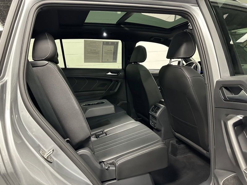 2023 Volkswagen Tiguan SE R-Line Black w/Sunroof in a Pyrite Silver Metallic exterior color and Black Heated Seatsinterior. Schmelz Countryside SAAB (888) 558-1064 stpaulsaab.com 