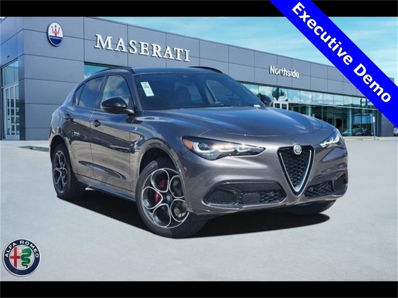 2024 Alfa Romeo Stelvio Ti Awd in a Vesuvio Gray Metallic exterior color and Chocolateinterior. Northside Alfa Romeo of Houston 281-475-4549 alfaromeousaofnorthhouston.com 