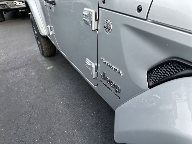 2024 Jeep Wrangler 4-door Sahara in a Silver Zynith Clear Coat exterior color and Blackinterior. Gupton Motors Inc 615-384-2886 guptonmotors.com 