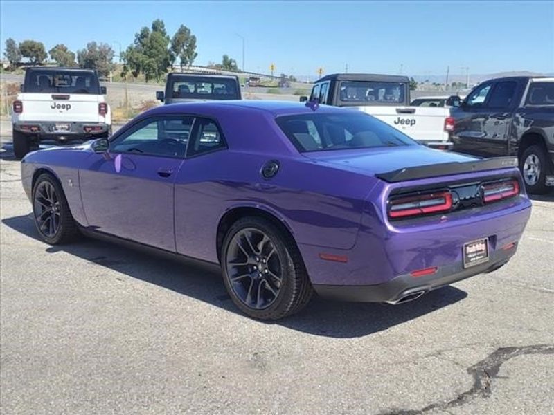 2023 Dodge Challenger R/T Scat Pack in a Plum Crazy Pearl Coat exterior color and Blackinterior. Perris Valley Auto Center 951-657-6100 perrisvalleyautocenter.com 