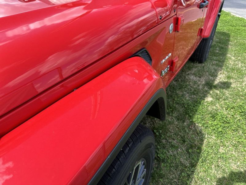 2024 Jeep Wrangler 4-door Sahara in a Firecracker Red Clear Coat exterior color. Gupton Motors Inc 615-384-2886 guptonmotors.com 