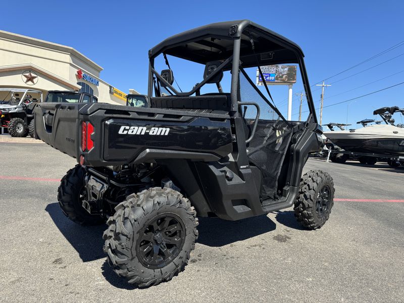 2024 CAN-AM DEFENDER XT HD10 TIMELESS BLACK  in a BLACK exterior color. Family PowerSports (877) 886-1997 familypowersports.com 