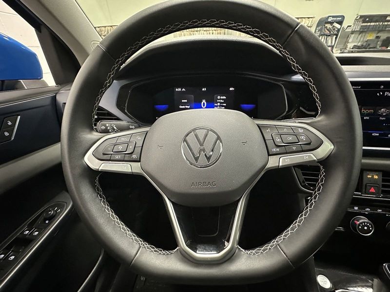 2023 Volkswagen Taos SE AWD w/Sunroof in a Cornflower Blue exterior color and Black Heated Seatsinterior. Schmelz Countryside SAAB (888) 558-1064 stpaulsaab.com 