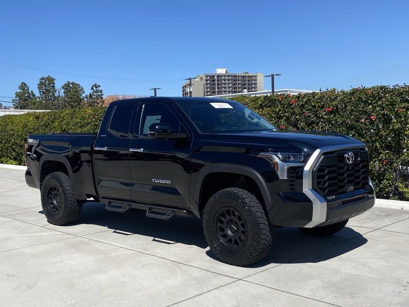 2023 Toyota Tundra Limited in a Midnight Black Metallic exterior color and BLK SOFTEXinterior. BEACH BLVD OF CARS beachblvdofcars.com 