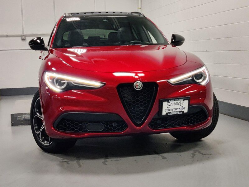 2023 Alfa Romeo Stelvio Veloce Q4 AWD w/Prem & Activ Pkg in a Rosso Etna exterior color and Black Heated Sport Leatherinterior. Schmelz Countryside Alfa Romeo and Fiat (651) 968-0556 schmelzfiat.com 