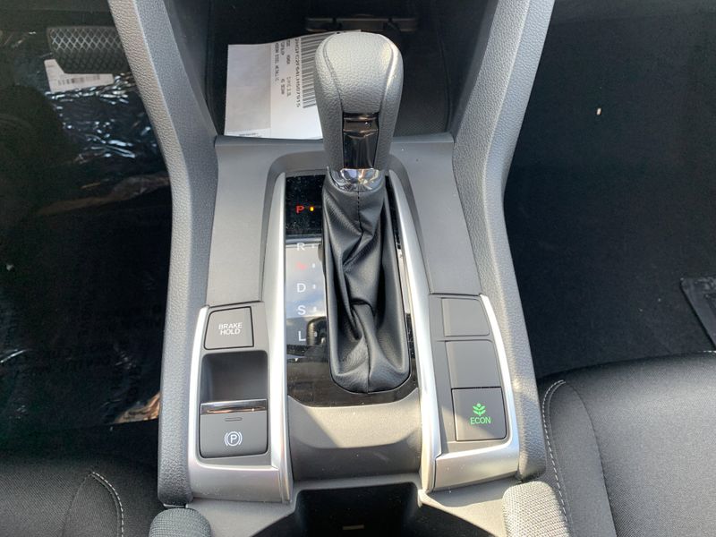 2020 Honda Civic Sedan LX in a White exterior color. BEACH BLVD OF CARS beachblvdofcars.com 