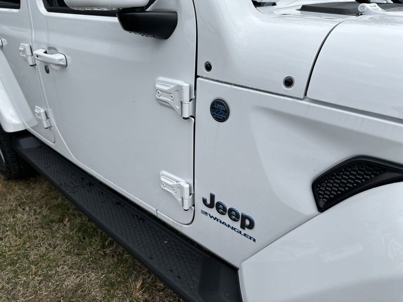 2024 Jeep Wrangler 4-door High Altitude 4xe in a Bright White Clear Coat exterior color and Green/Blackinterior. Gupton Motors Inc 615-384-2886 guptonmotors.com 