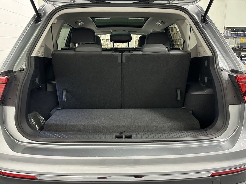 2023 Volkswagen Tiguan SE w/Sunroof & 3rd Row in a Pyrite Silver Metallic exterior color and Black Heated Seatsinterior. Schmelz Countryside Alfa Romeo and Fiat (651) 968-0556 schmelzfiat.com 