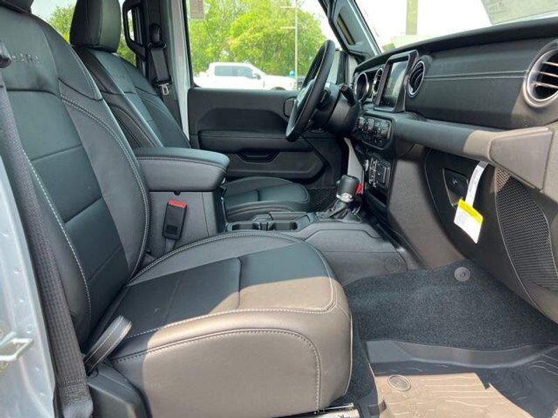 2023 Jeep Wrangler Sahara 4xe in a Silver Zynith Clear Coat exterior color and Blackinterior. Lakeshore CDJR Seaford 302-213-6058 lakeshorecdjr.com 
