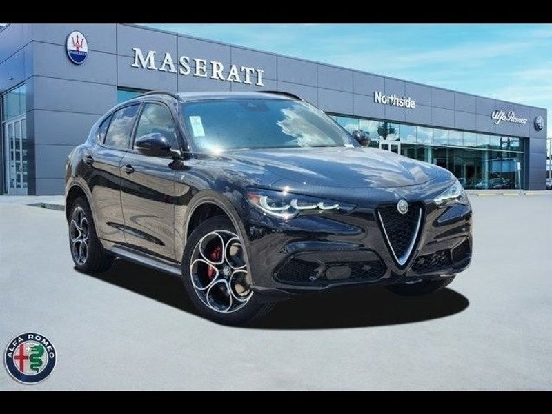 2024 Alfa Romeo Stelvio Ti in a Vulcano Black Metallic exterior color and Chocolateinterior. Northside Imports Houston 281-475-4549 northsideimportshouston.com 