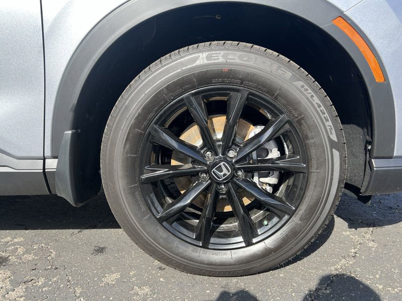 2024 Honda CR-V Hybrid Sport-L in a Silver exterior color. BEACH BLVD OF CARS beachblvdofcars.com 