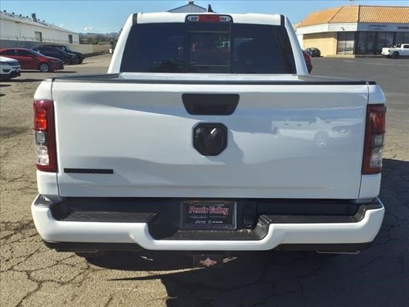 2024 RAM 1500 Big Horn Lone Star in a Bright White Clear Coat exterior color and Blackinterior. Perris Valley Auto Center 951-657-6100 perrisvalleyautocenter.com 