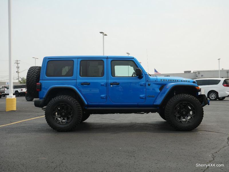 2023 Jeep Wrangler Rubicon 4xe in a Hydro Blue Pearl Coat exterior color and Black/Dark Saddleinterior. Paul Sherry Chrysler Dodge Jeep RAM (937) 749-7061 sherrychrysler.net 