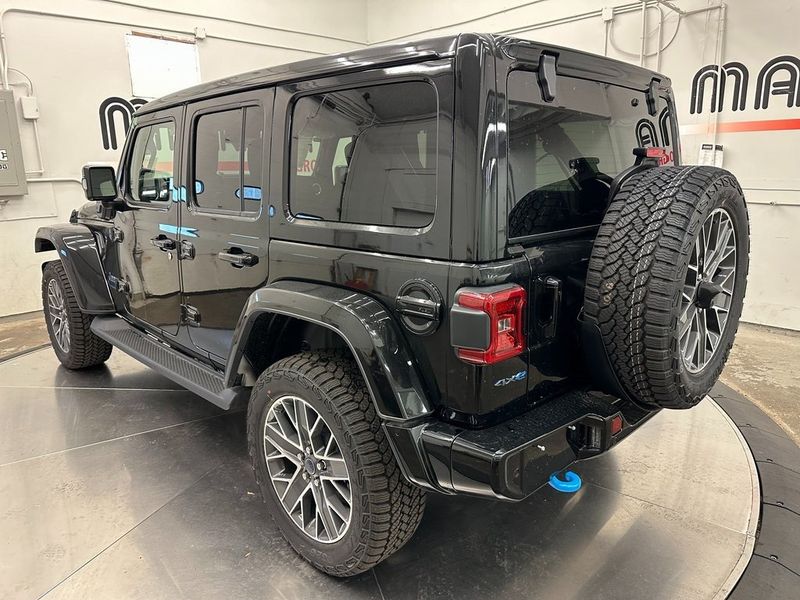 2024 Jeep Wrangler 4-door High Altitude 4xe in a Black Clear Coat exterior color and Green/Blackinterior. Marina Auto Group (855) 564-8688 marinaautogroup.com 