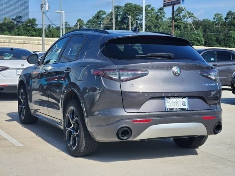 2024 Alfa Romeo Stelvio Ti in a Vesuvio Gray Metallic exterior color and Chocolateinterior. Northside Imports Houston 281-475-4549 northsideimportshouston.com 