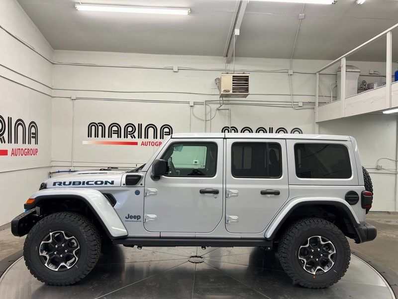 2023 Jeep Wrangler Rubicon 4xe in a Silver Zynith Clear Coat exterior color and Blackinterior. Marina Chrysler Dodge Jeep RAM (855) 616-8084 marinadodgeny.com 