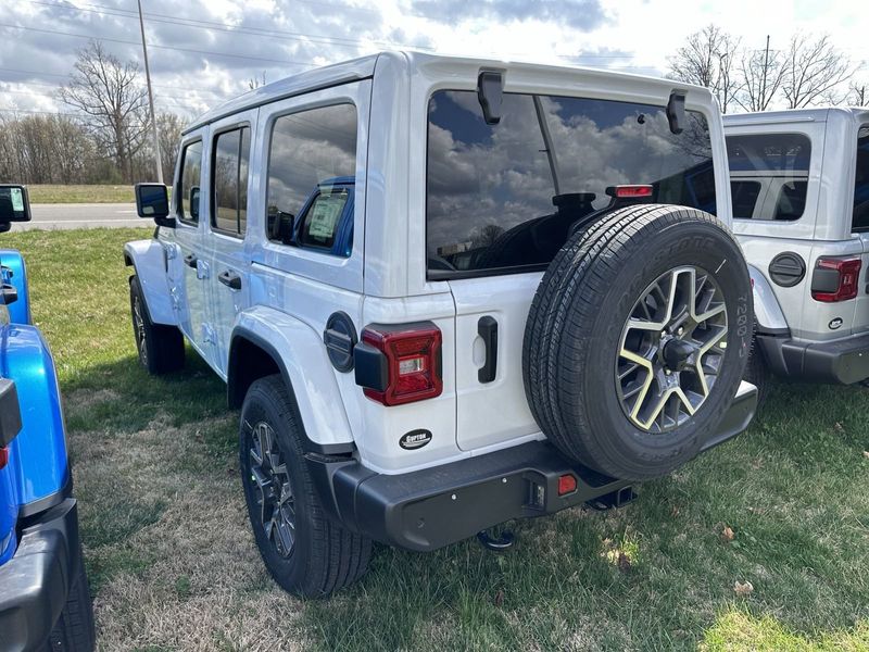 2024 Jeep Wrangler 4-door Sahara in a Bright White Clear Coat exterior color. Gupton Motors Inc 615-384-2886 guptonmotors.com 