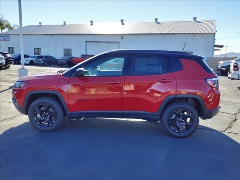 2024 Jeep Compass Trailhawk in a Prm exterior color and Ruby Red/Blackinterior. Perris Valley Auto Center 951-657-6100 perrisvalleyautocenter.com 