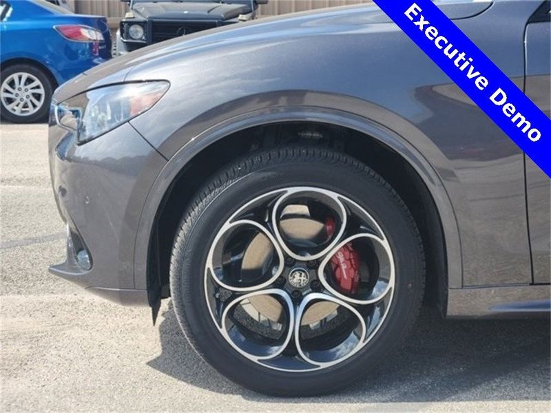 2024 Alfa Romeo Stelvio Ti Awd in a Vesuvio Gray Metallic exterior color and Chocolateinterior. Northside Alfa Romeo of Houston 281-475-4549 alfaromeousaofnorthhouston.com 