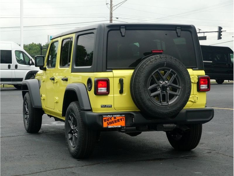 2024 Jeep Wrangler 4-door Sport S in a High Velocity Clear Coat exterior color and Blackinterior. Paul Sherry Chrysler Dodge Jeep RAM (937) 749-7061 sherrychrysler.net 