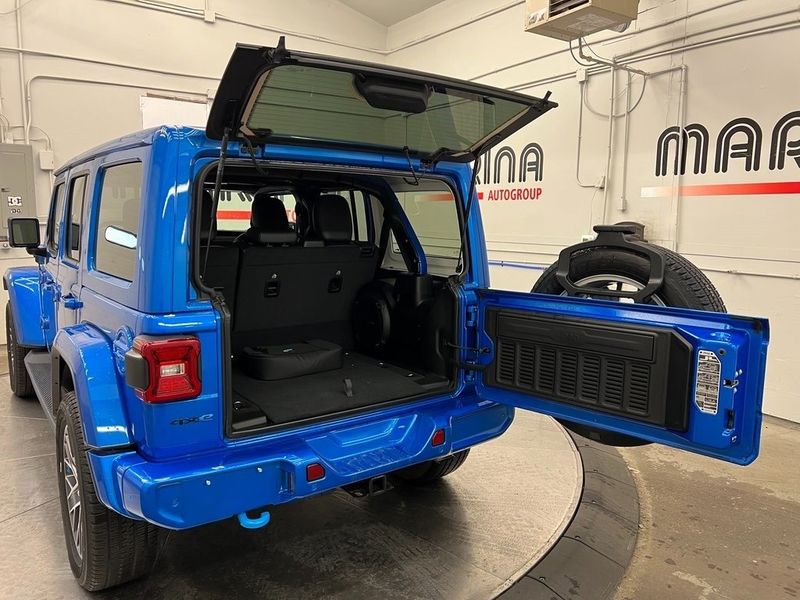 2022 Jeep Wrangler 4xe Unlimited High Altitude 4x4 in a Hydro Blue Pearl Coat exterior color and Blackinterior. Marina Auto Group (855) 564-8688 marinaautogroup.com 