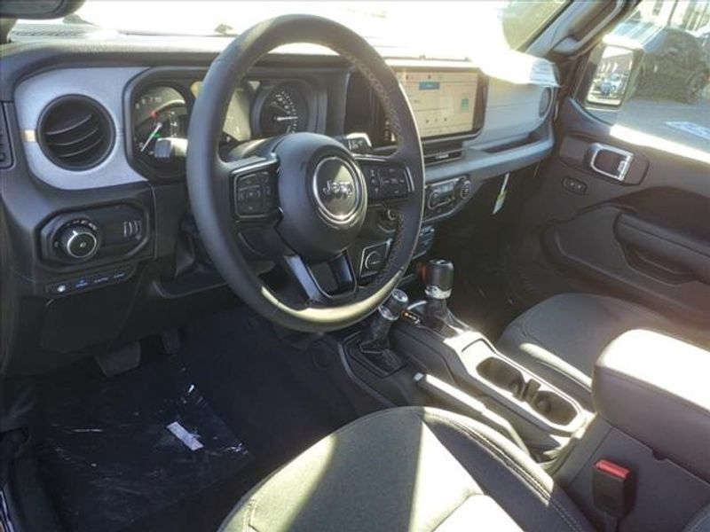 2024 Jeep Wrangler Sport S 4xe in a Black Clear Coat exterior color and Blackinterior. Perris Valley Auto Center 951-657-6100 perrisvalleyautocenter.com 