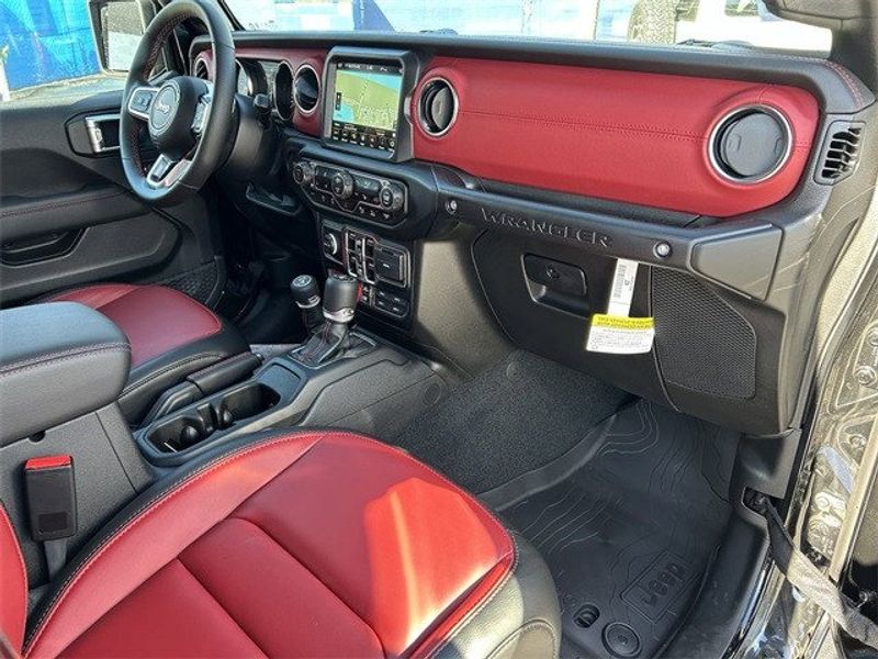 2023 Jeep Wrangler 4-door Rubicon 392 in a Black Clear Coat exterior color and Red/Blackinterior. McPeek