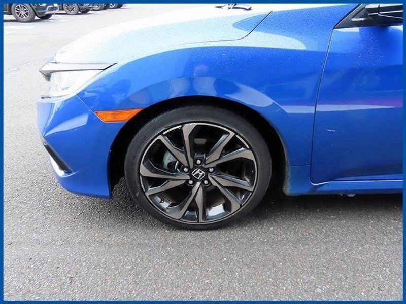 2021 Honda Civic Sport in a Blue exterior color and Blackinterior. Papas Jeep Ram In New Britain, CT 860-356-0523 papasjeepram.com 