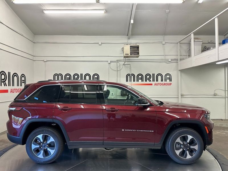 2024 Jeep Grand Cherokee 4xe in a Velvet Red Pearl Coat exterior color and Global Blackinterior. Marina Auto Group (855) 564-8688 marinaautogroup.com 