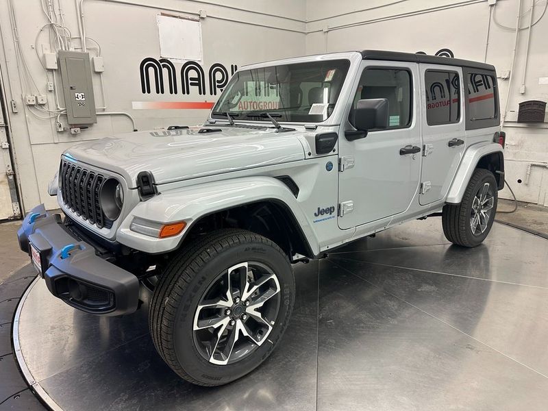 2024 Jeep Wrangler 4-door Sport S 4xe in a Silver Zynith Clear Coat exterior color and Blackinterior. Marina Auto Group (855) 564-8688 marinaautogroup.com 